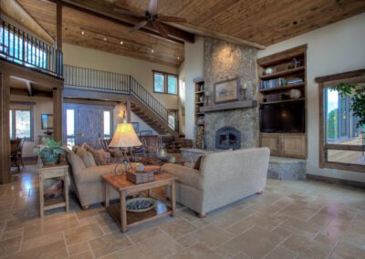 A living room with a fireplace and a couch.