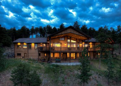 A home in the woods at dusk.